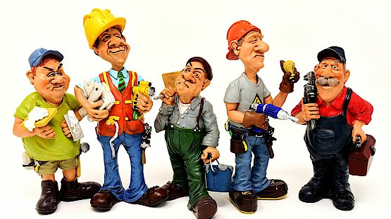 fünf Bauarbeiter als Comicfigur